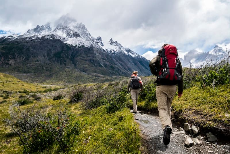 Pilgrim hiking on mountain trail